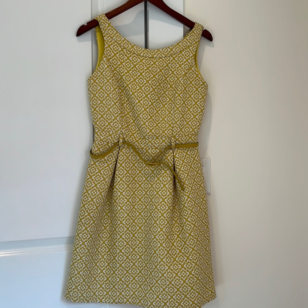 Yumi brand name.  Gold/yellow dress full lining with belt.